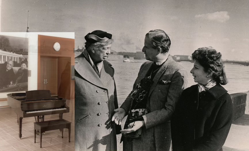 Eleanor Roosevelt stands with a man and woman talking.  An inset photo of a piano with a large photo of FDR and ER behind in on the wall.