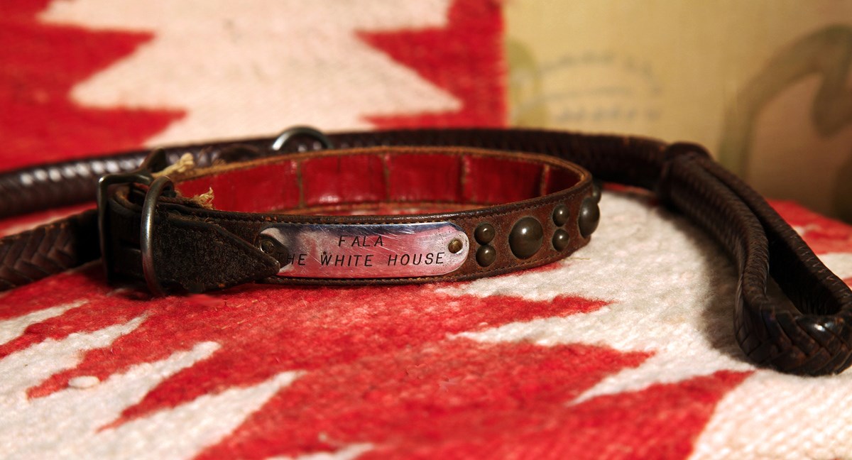 A leather leash and dog collar with silver plate engraved "Fala, White House"