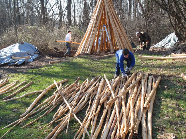 Volunteers Rebuild the Colliers Hut with wood.