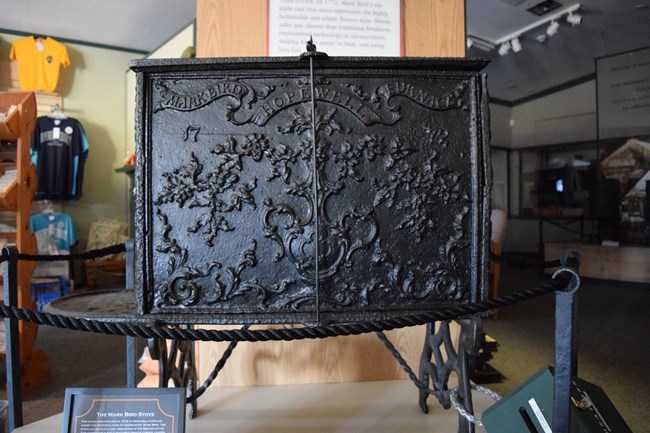 6-Plate cast iron stove widely known as the "Mark Bird Stove". It has inscriptions that read "Hopewell", "Furnace", "Mark", "Bird", "1772".