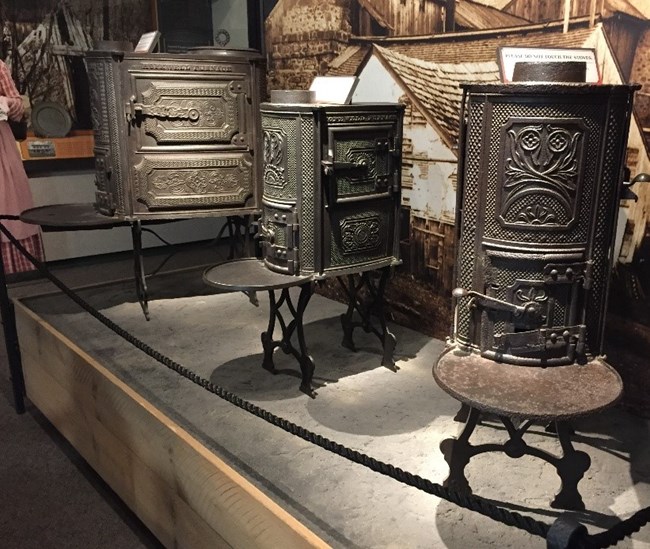 Three 10-Plate cast iron stoves on display at Hopewell Furnace's Visitor Center.
