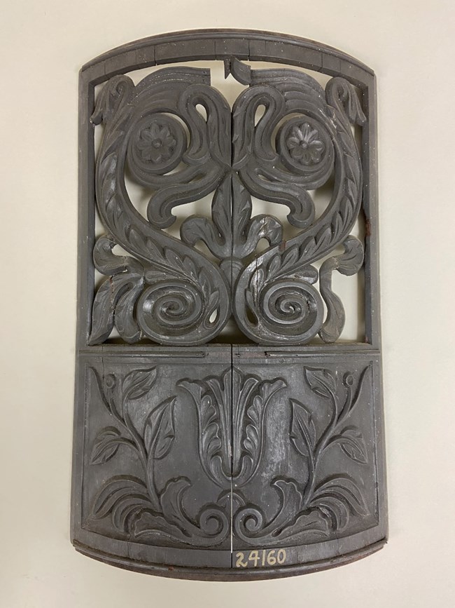 Black wooden stove pattern with ornate design used by moulders for making cast iron stoves.