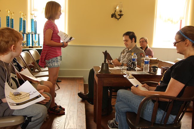 Spelling bee participants inside the Freeman School.