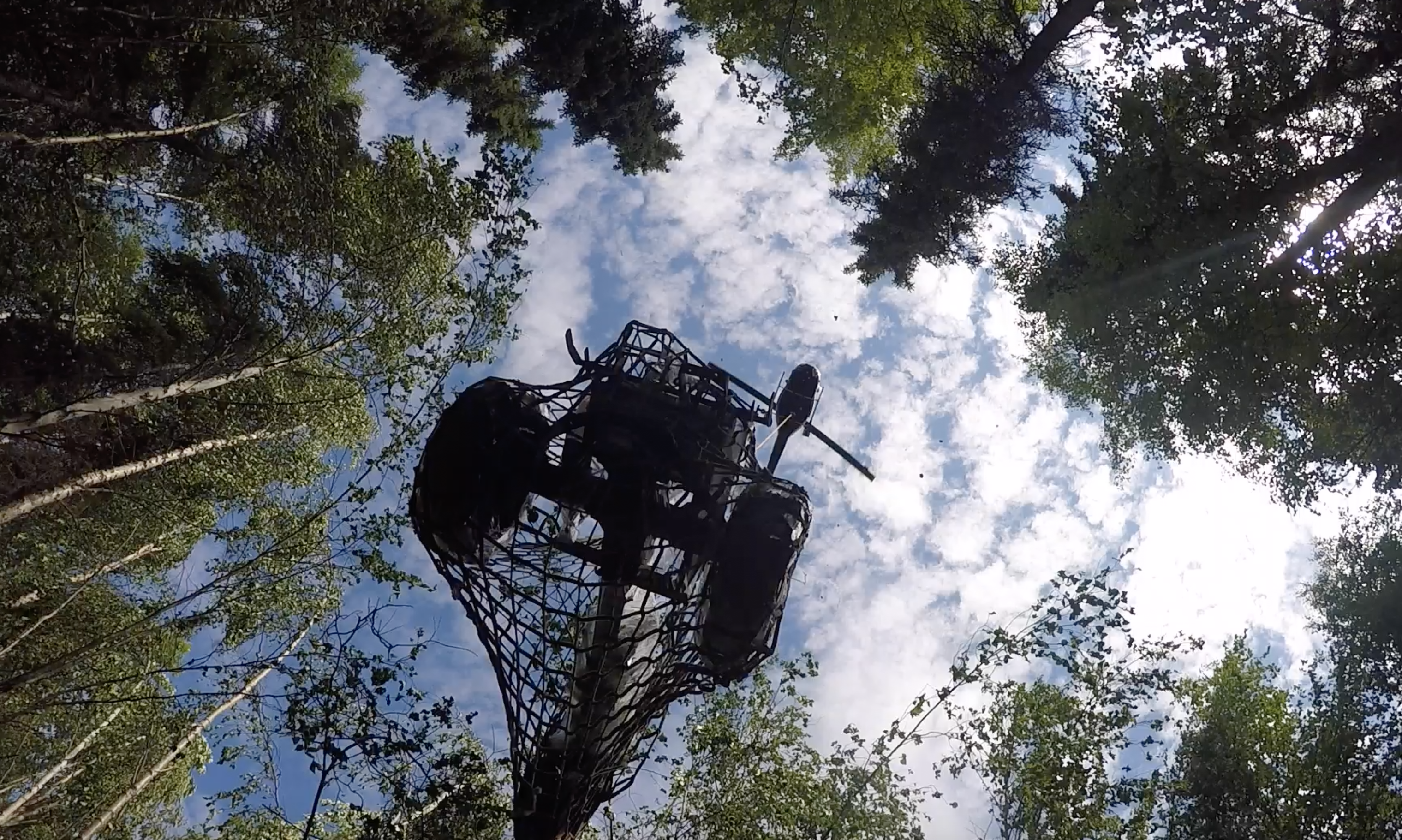 Helicopter Airlifting Deardorff Tractor out of Alaskan Wilderness