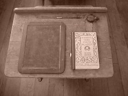 Freeman School desk with McGuffey's Reader