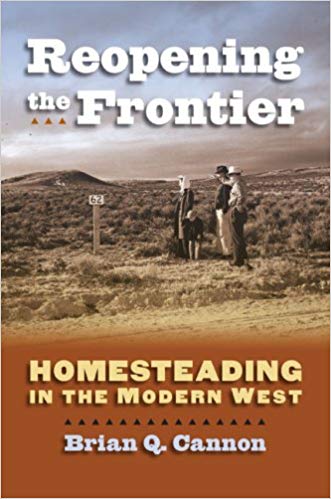 Reopening the Frontier: Homesteading in the Modern West Book Cover featuring a black and white photo of three people looking at a mile marker in the mountainous desert.