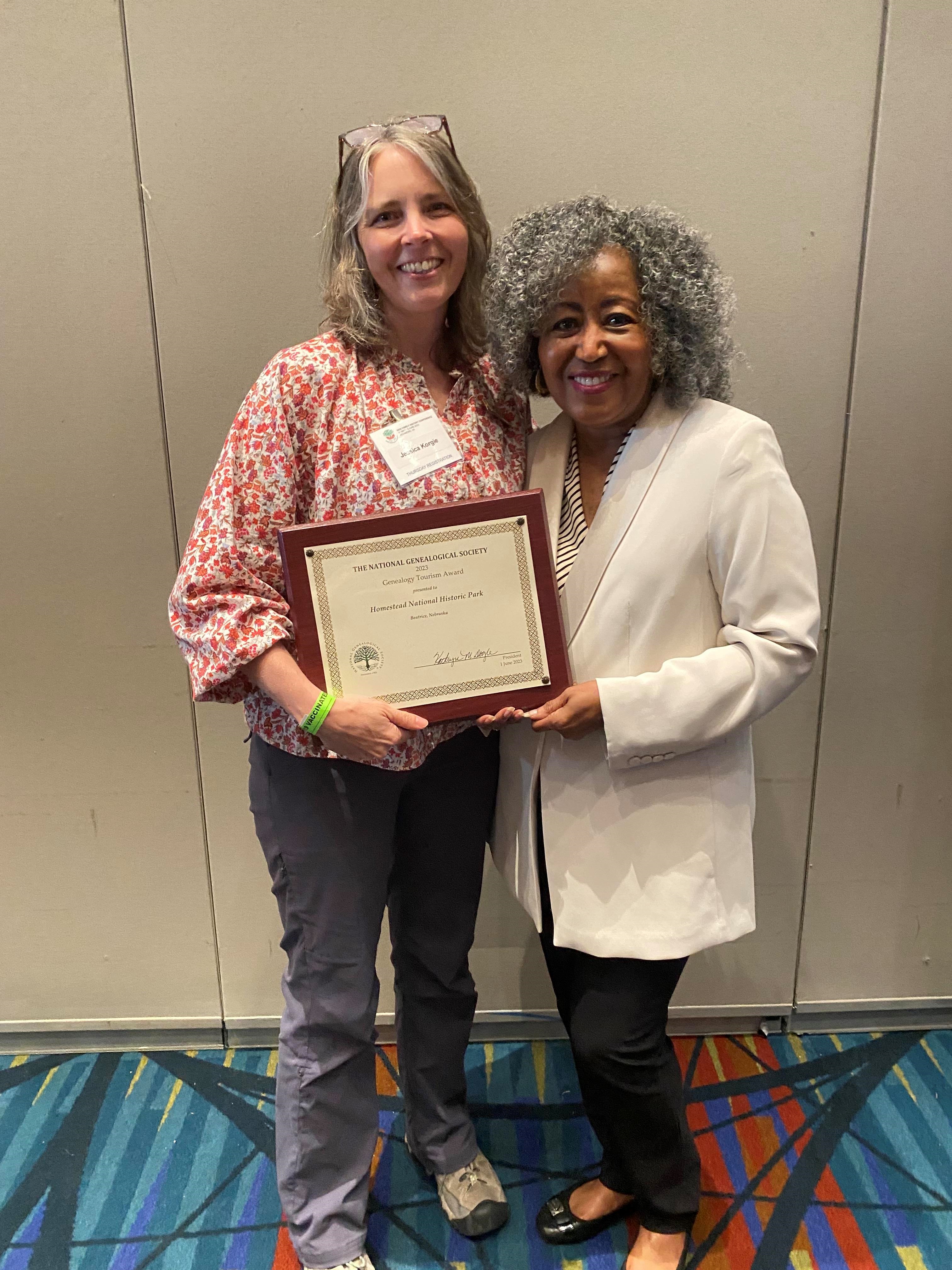NGS Award Jessica Korgie and Bernice Bennett Image of two women holding up an award.