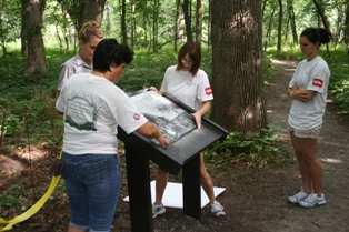 Exmark Volunteers install wayside exibit.