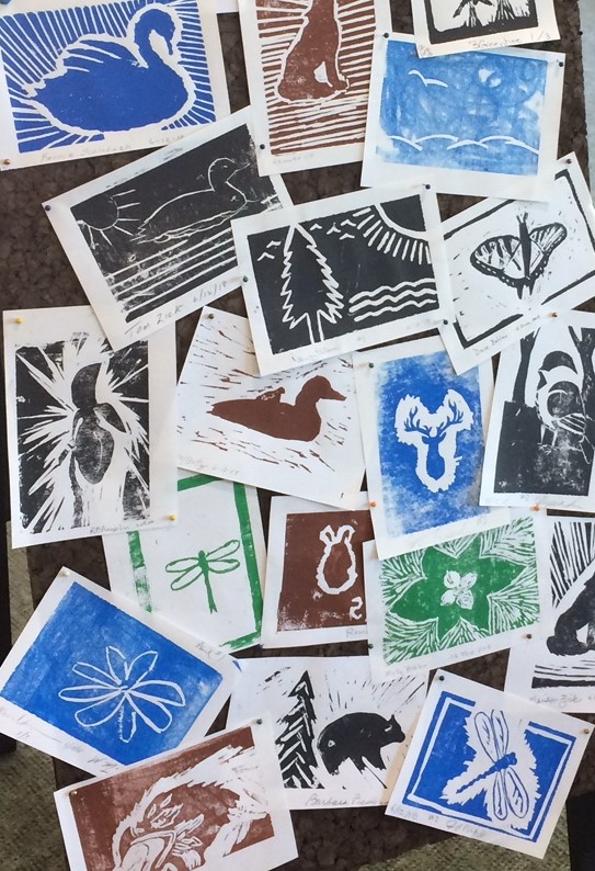 Several colorful woodblock prints depicting wildlife.