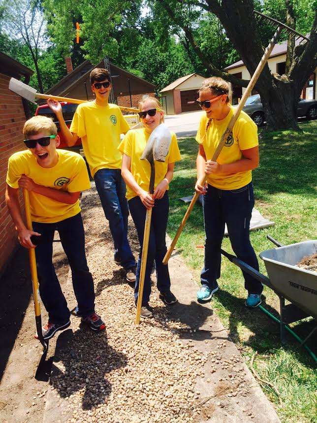 Youth Conservation Corps Crew 2016 Four young people smile while holding gardening tools.