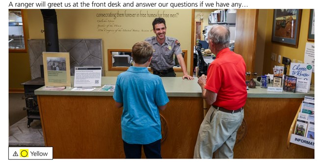 Photo show a young and older man engaging with a ranger. Text reads: "A ranger will greet us at the front desk and answer our questions if we have any…"