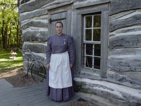 Woman in front of Cabin