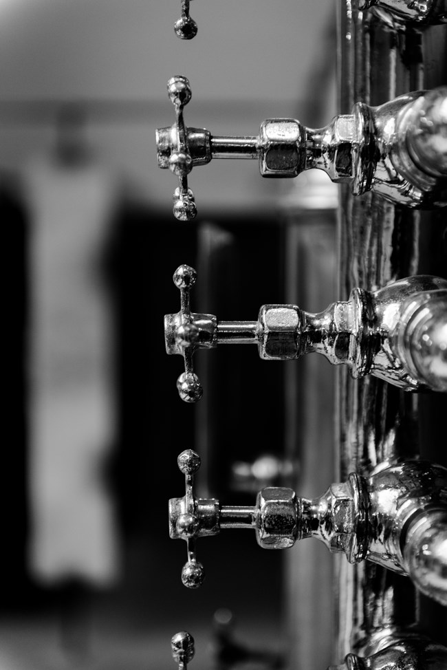 Black and white photo of water pressure handles