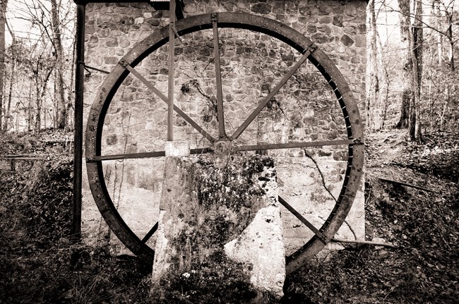 Sepia-toned water wheel