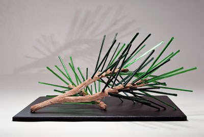 Art Glass "Pine Needles". Brown forked branch with medium and dark green "needles" that are glass rods.