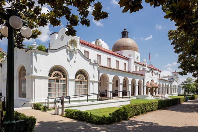 Side view of the white, stucco Quapaw Bathhouse.