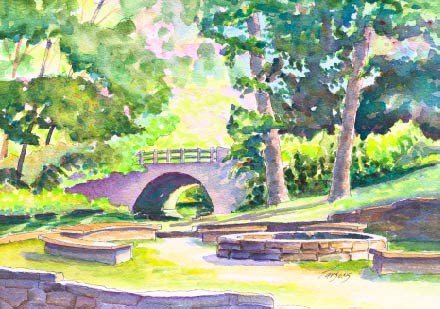 watercolor painting showing rock fire ring in right foreground with arc-shaped rock benches on the left; center of picture is a bridge flanked by trees