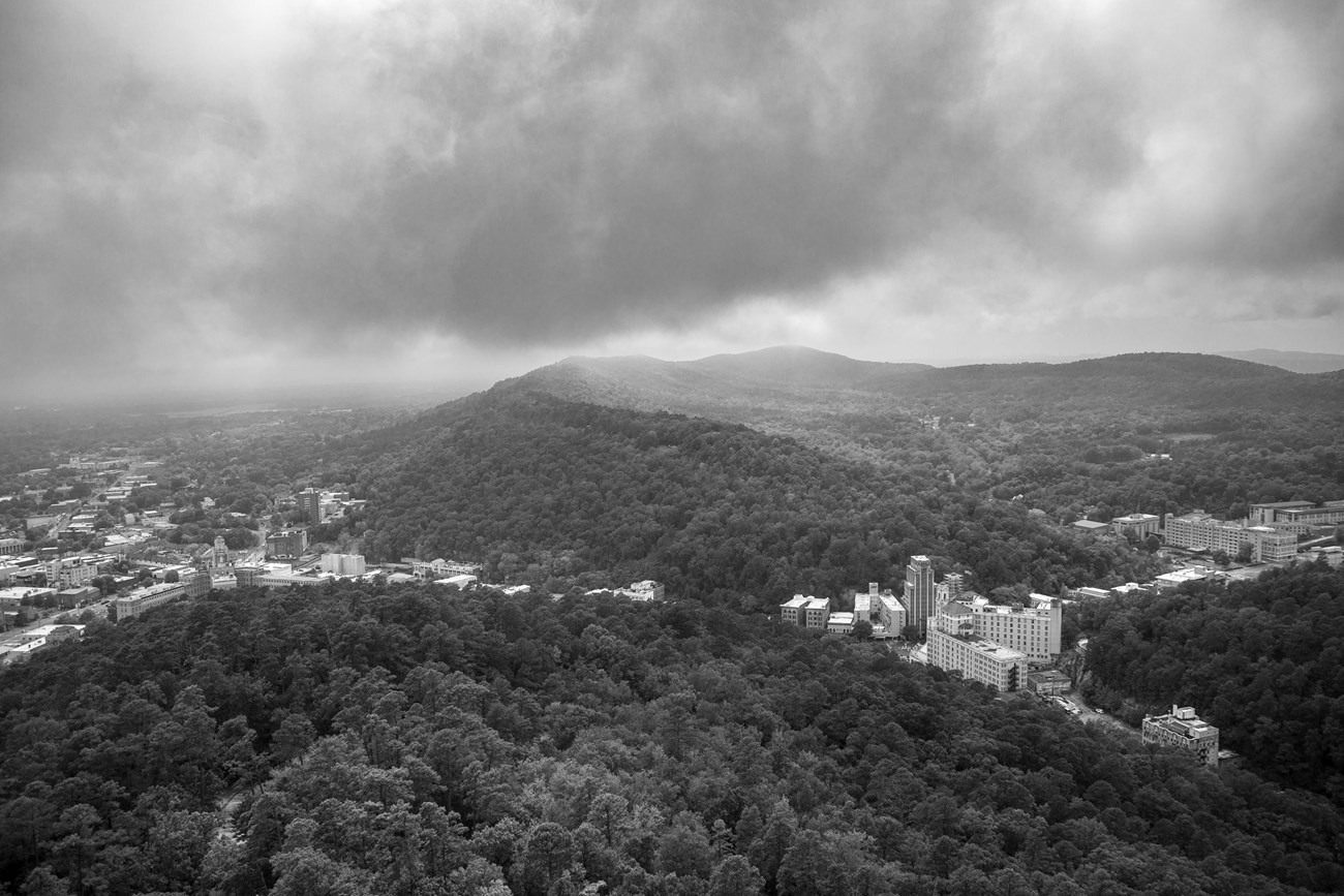 A black and white photo of the rolling Ouachita Mountains