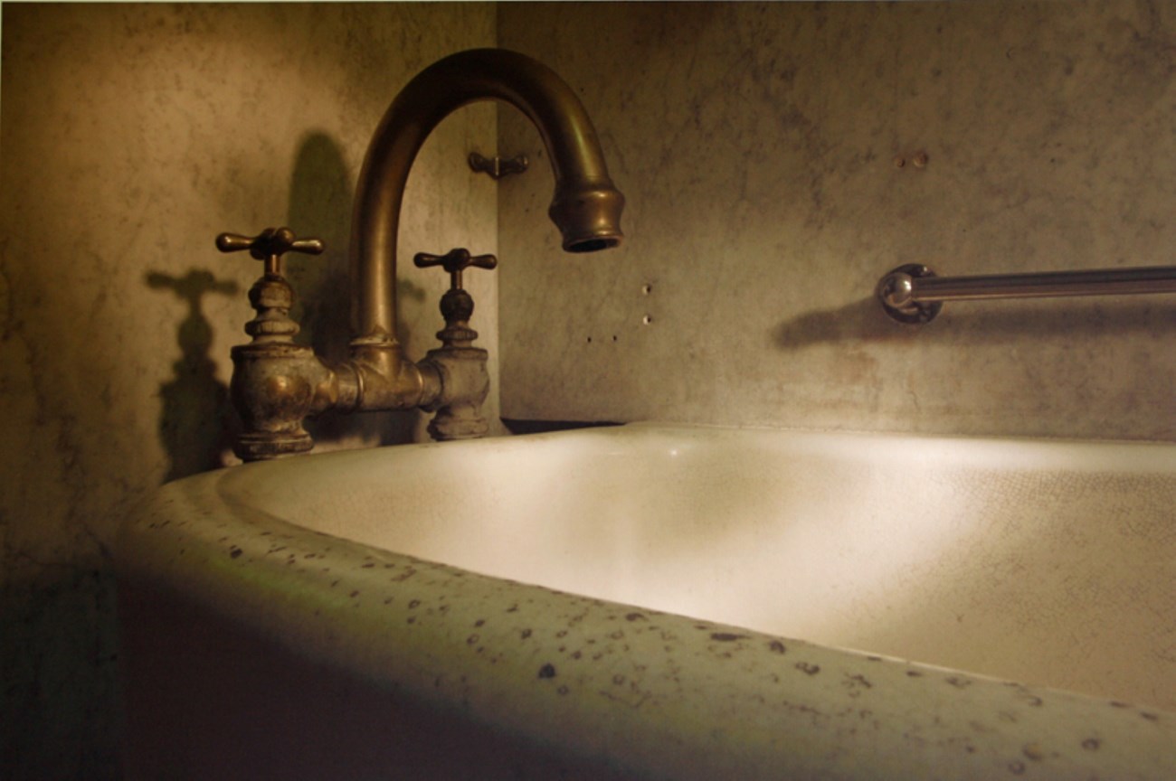 A sepia toned photograph of a historic bathtub