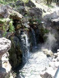 color photo of the portion of the hot spring water cascade above the Grand Promenade, showing the tufa build up around it color photo of the portion of the hot spring water cascade above the Grand Promenade, showing the tufa build up around it