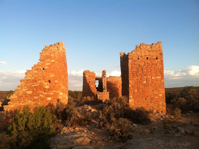 remains of a large stone complex in the rising sun