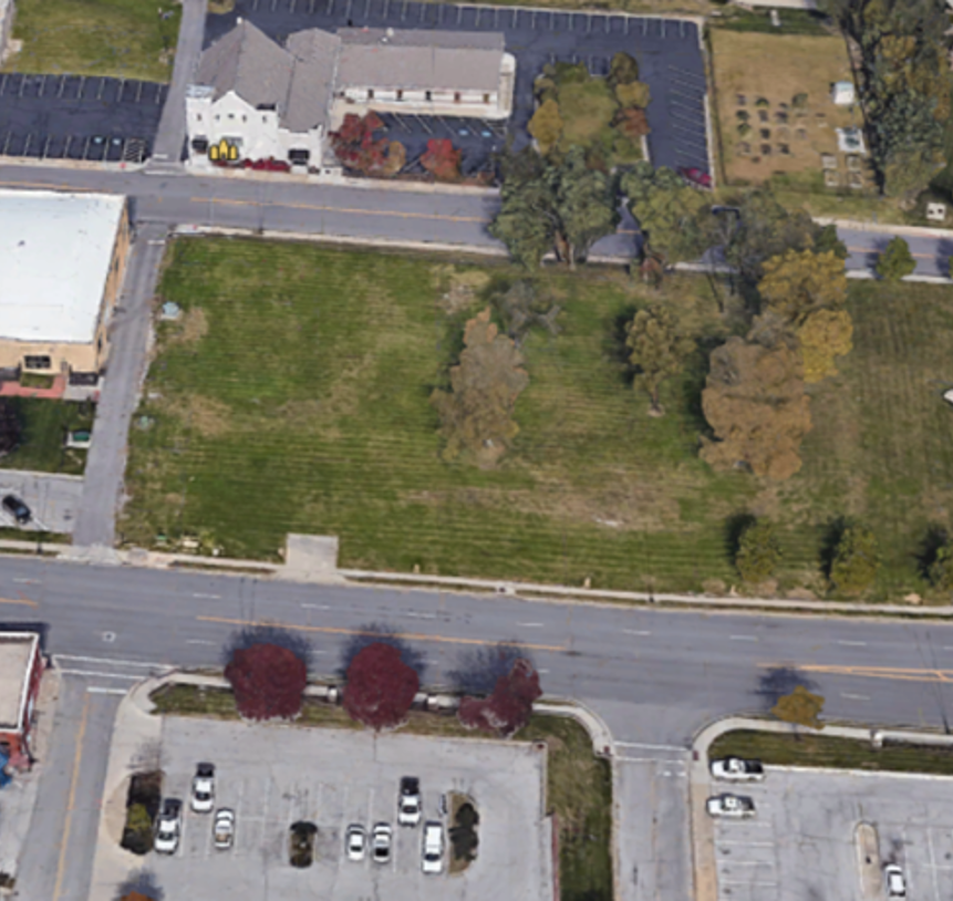 An arial photograph shows a vacant property lot, the lot on which the future park visitor services facility is to be built for Harry S Truman National Historic Site.