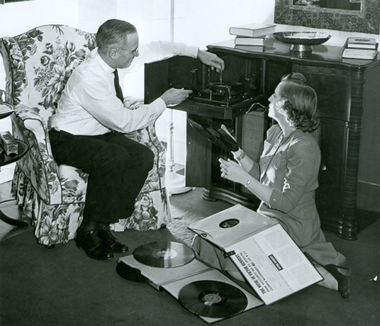 Senator Truman and his daughter Margaret listen to music in their Washington D.C. home, April 1942
