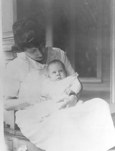 Bess Truman holding infant Margaret on porch of Truman Home, 1924. Harry S. Truman Libary, #83-10.