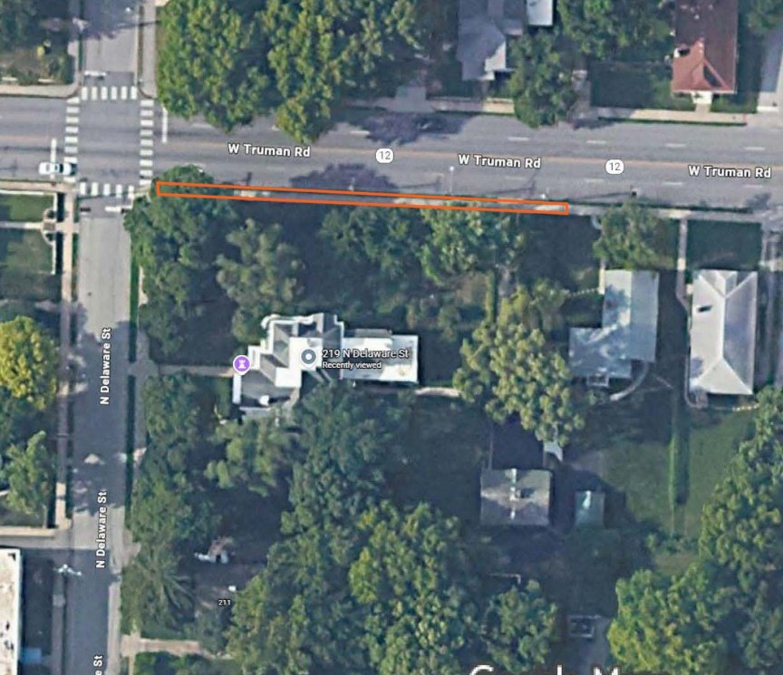 Aerial photograph of the Truman home with designated demonstration area outlined along the north sidewalk along W Truman Road.