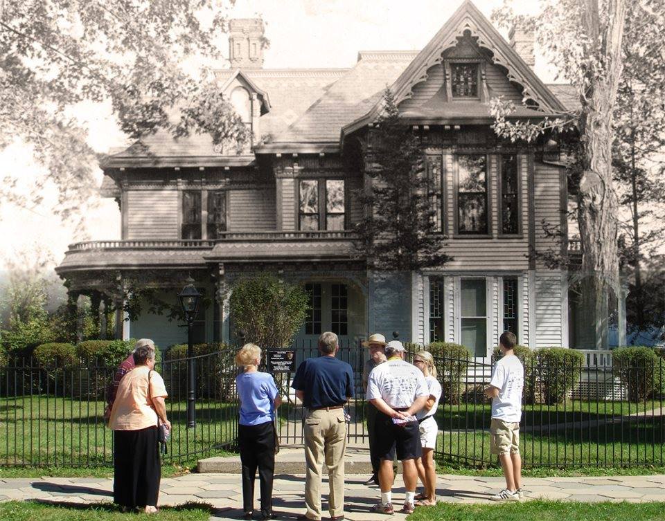 A blended black and white and color photo shows visitors in front of the Truman Home