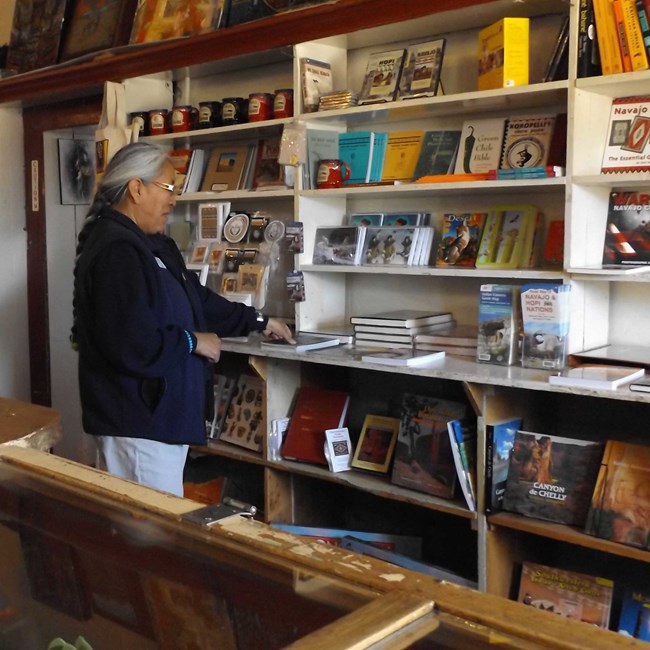 Park Store manager inspects new books Park Store manager inspects new books