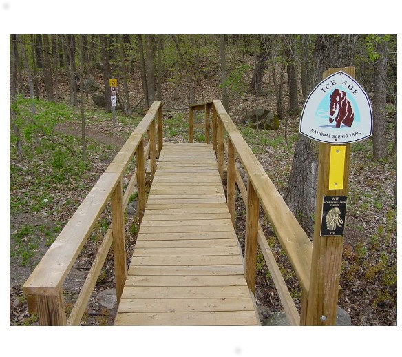 Ice Age Trail markers and bridge along Blueberry Segment. Ice Age Trail markers and bridge along Blueberry Segment.