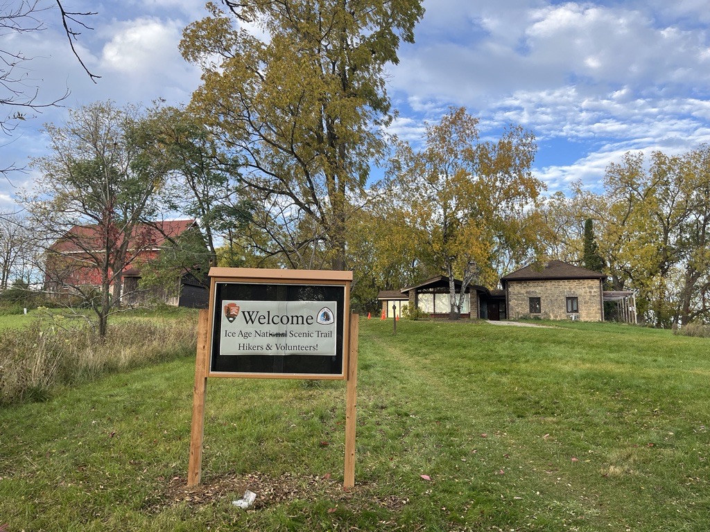 Cross Plains Contact Station Image shows a sign welcoming volunteers and hikers to the site.