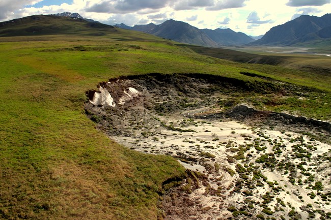 A thermokarst thaw slump in a mountain valley