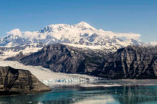 CAKN_MtStElias_BrianPetryl A panorama of the Chugach Mountains with a tidewater glacier and Mt St Ellias in the background.