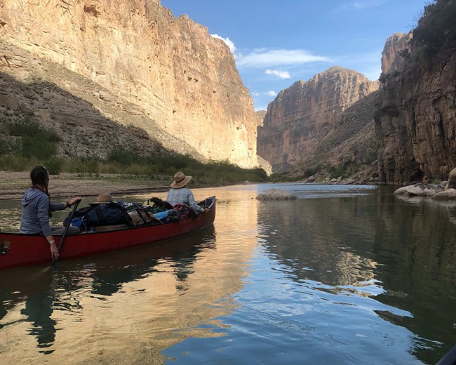 Scientists in a canoe on the Rio Grande River in Boquillas Canyon at Big Bend National Park