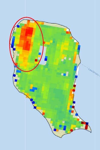 Map of North Manitou Island overlaid with colored pixels. Most are green, with scattered blue, yellow, orange, and red pixels around the shoreline. A large mass of red pixels edged in yellow and orange is circled on the northwest side of the island.