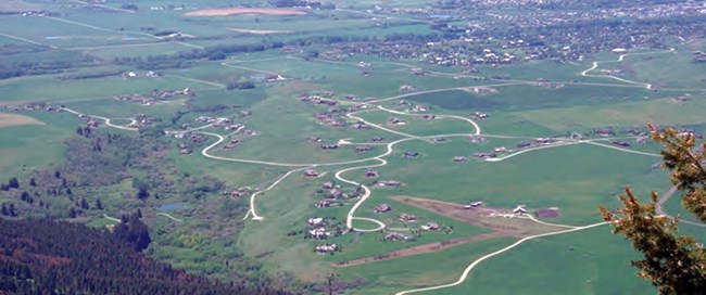 roads and houses snaking out into a rural area