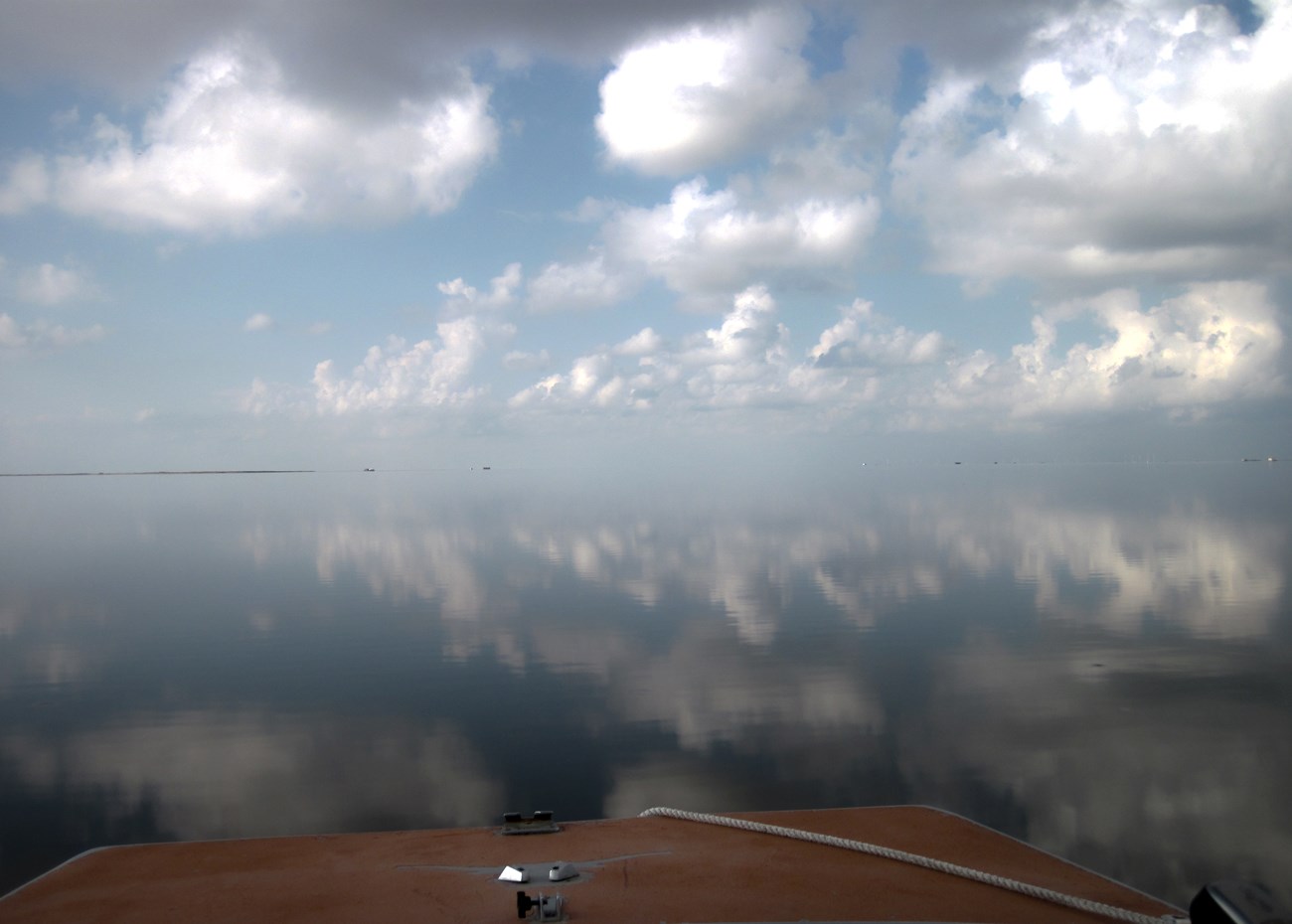 smooth water on the Laguna Madre with front of boat in view