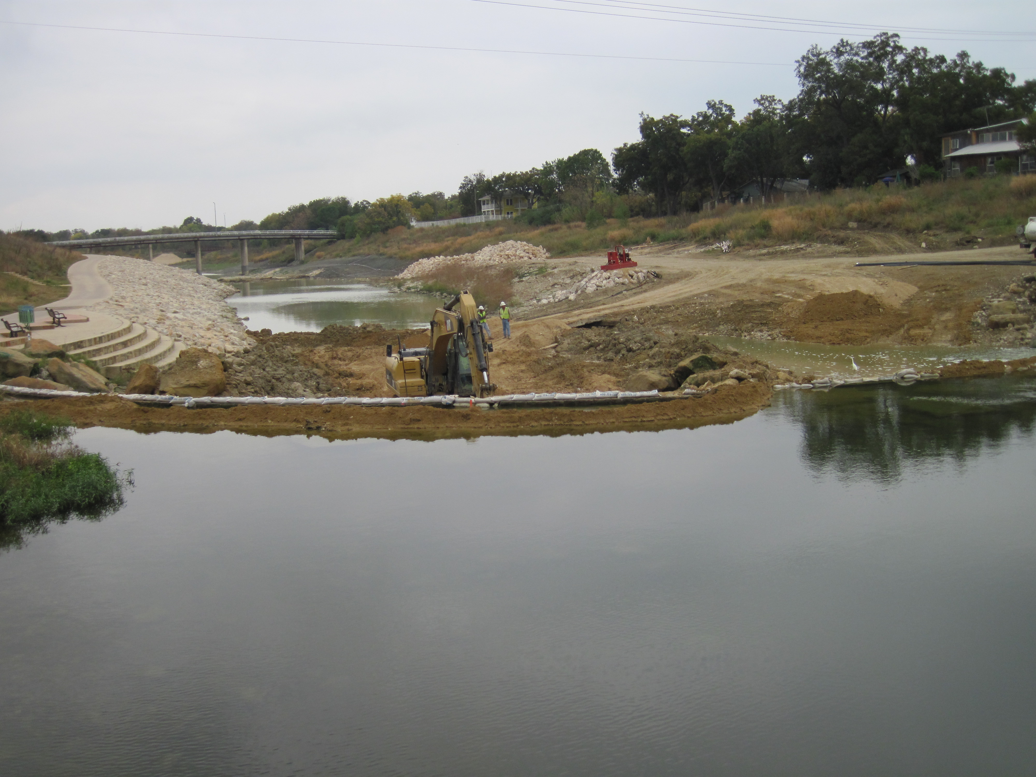 Construction machinery building a riverwalk near a National Park