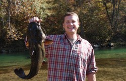 Tyler Cribbs Tyler Cribbs holdung up a giant fish
