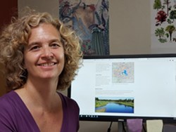 A woman sitting at a computer