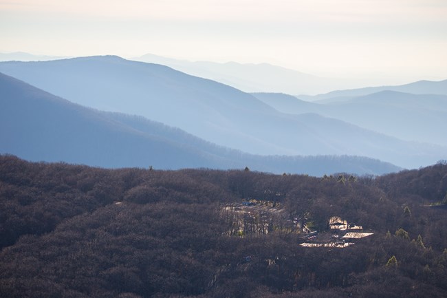 Mountains near and far, eventually disappearing completely into heavy haze