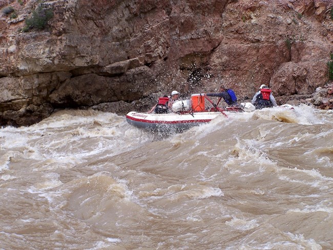 Rafting in Split Mountain Canyon showcases the popularity—and impact—of recreational river use. Raft navigating whitewater rapids in Split Mountain Canyon