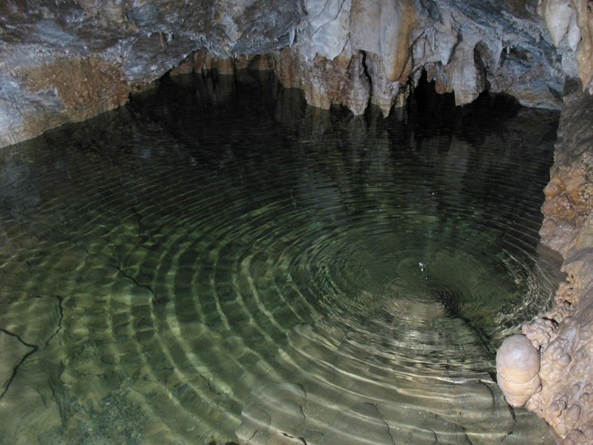 Cave water with rings from dripping Cave water with rings from dripping