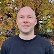 Charles_Wainright Portrait of smiling man in front of autumn tree