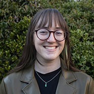 Head shot of smiling white woman with glasses