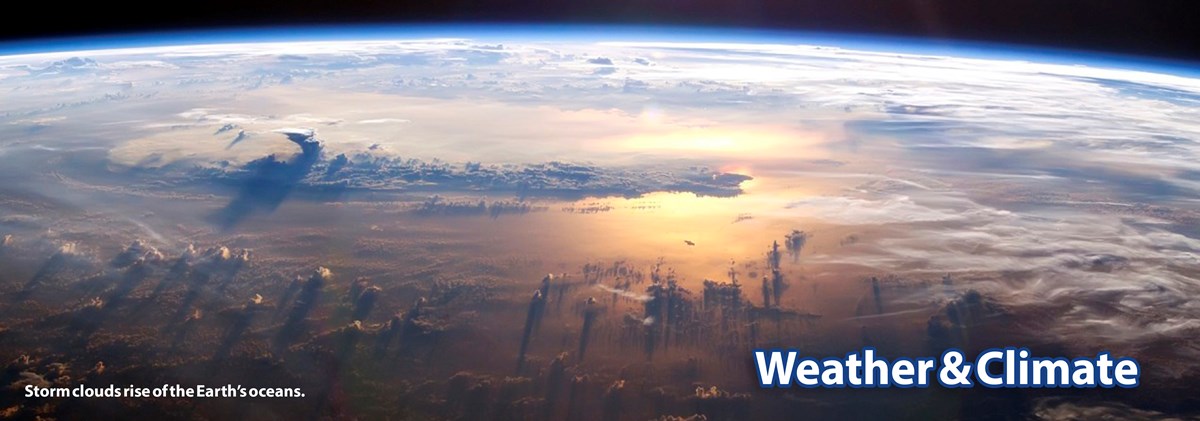 A satellite photo showing clouds forming over the ocean and a thin blue atmosphere over the curvature of Earth A satellite photo showing clouds forming over the ocean and a thin blue atmosphere over the curvature of Earth