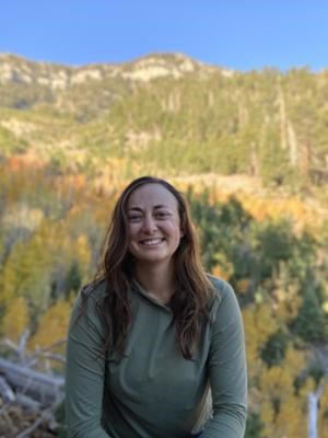 Person in green shirt smiling