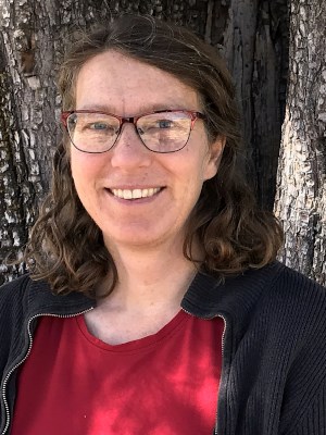 Smiling woman in glasses.